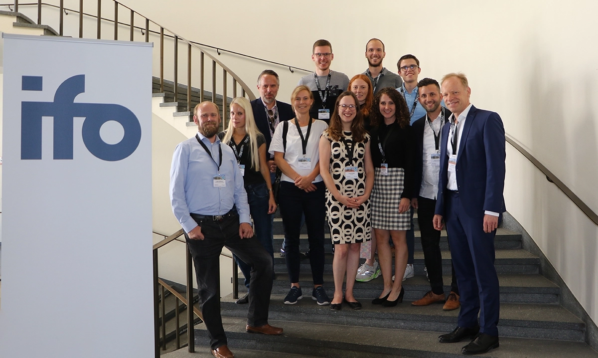  group picture of ifo scientist on the stairs at the conference in Basel